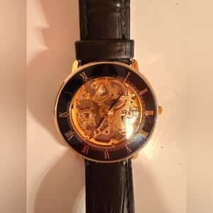 Tourneau Black and Gold Skeleton Watch